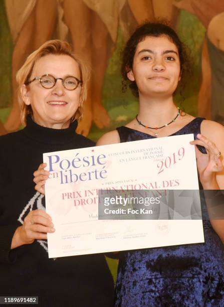 Mayor Florence Berthout awards Selma Bandada during "Poesie En Liberté": 2019 Awards Ceremony At Mairie Du 5eme on November 23, 2019 in Paris, France.