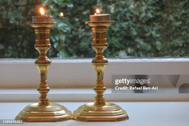 sabbath candles lit on friday evening - jewish sabbath stock pictures, royalty-free photos & images