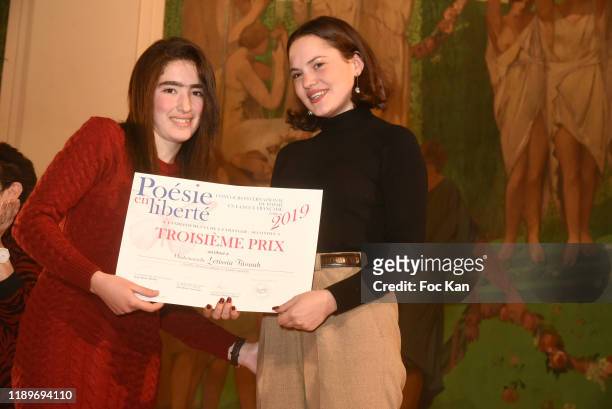 Clémence Boisnard awards a Poesie En Liberté competitor during "Poesie En Liberté": 2019 Awards Ceremony At Mairie Du 5eme on November 23, 2019 in...