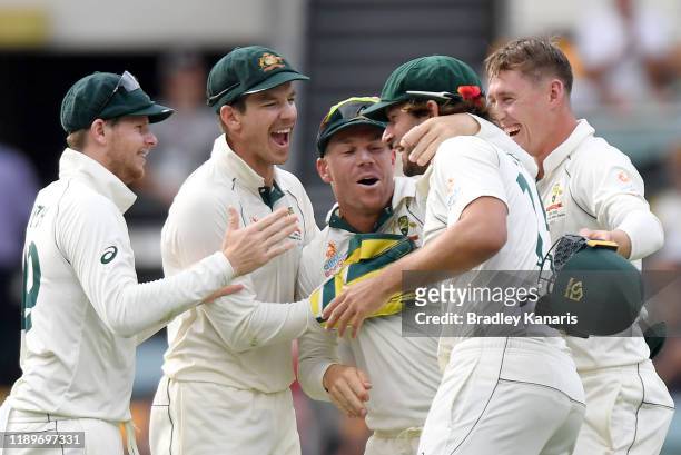 Tim Paine, Steve Smith, Joe Burns, David Warner and Marnus Labuschagne of Australia celebrate victory during day four of the 1st Domain Test between...