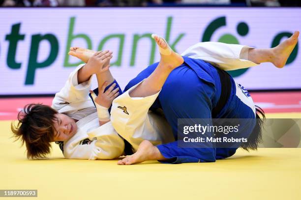 Shori Hamada of Japan and Mami Umeki of Japan compete in the Women's -78kg Final on day three of the Judo Grand Slam at the Maruzen Intec Arena Osaka...