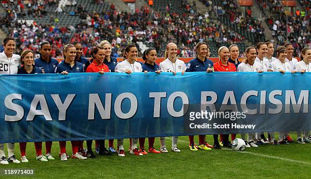 The two teams line up behind a say no to racism banner during the FIFA Women's World Cup 2011 Semi Final match between France and USA at Borussia...