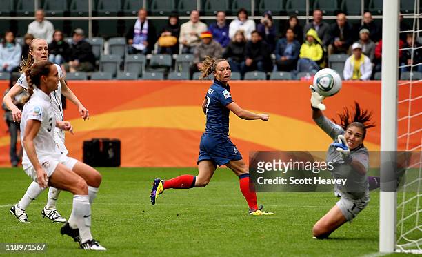 Gaetane Thiney of France watches as a cross from Sonia Bompastor floats past Hope Solo of USA to make it 1-1 during the FIFA Women's World Cup 2011...
