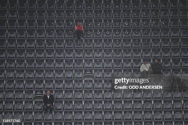 Few fans watch the FIFA women's football World Cup semi-final match France vs USA in Moenchengladbach, western Germany, on July 13, 2011. AFP PHOTO /...