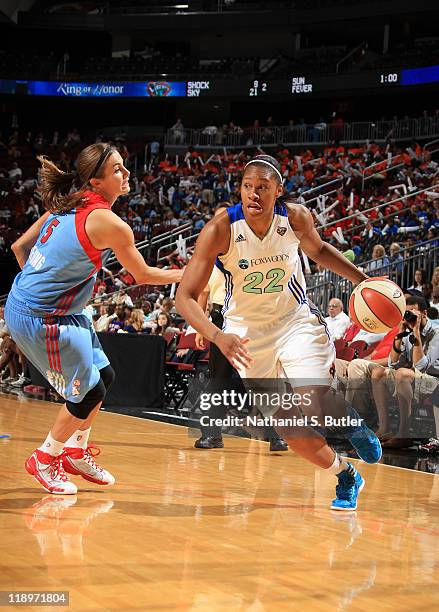 Alex Montgomery of the New York Liberty drives against Shalee Lehning of the Atlanta Dream during a game on July 13, 2011 at the Prudential Center in...