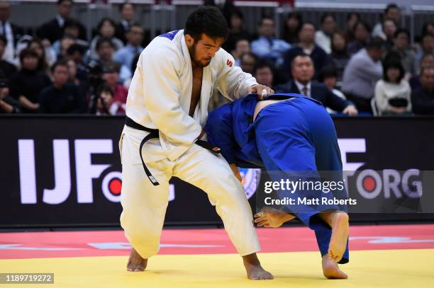 Alisher Yusupov of Uzbekistan and Daigo Kagawa of Japan compete in the Men's +100kg bronze final on day three of the Judo Grand Slam at the Maruzen...