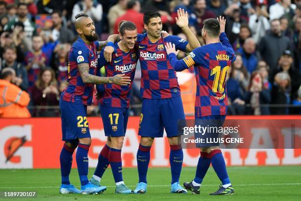 Barcelona's French forward Antoine Griezmann celebrates with Barcelona's Chilean midfielder Arturo Vidal, Barcelona's Uruguayan forward Luis Suarez...