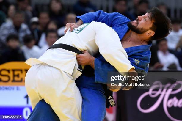 Davlat Bobonov of Uzbekistan and Beka Gviniashvili of Georgia compete in the Men's -90kg Final on day three of the Judo Grand Slam at the Maruzen...