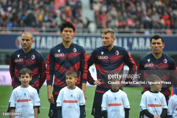 Players of Bologna FC show the red sign on their cheeks for 'a red against the violence' during the Serie A match between Bologna FC and Parma Calcio...