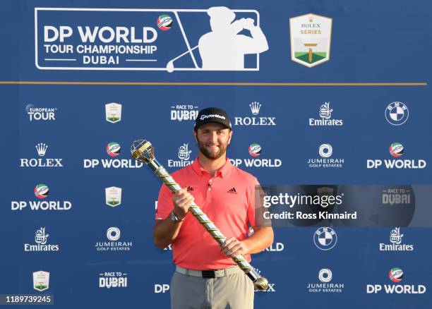 Jon Rahm of Spain poses with the DP World Tour Championship trophy following his victory during Day Four of the DP World Tour Championship Dubai at...