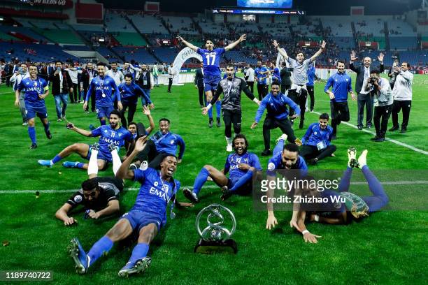 Players of Al Hilal celebrates the champion with the trophy after the AFC Champions League Final second leg match between Urawa Red Diamonds and Al...