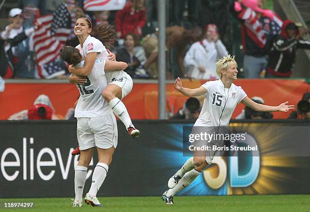 Alex Morgan of USA celebrates her team's 3rd goal with her team mates Lauren Cheney and Kelly O Hara during the FIFA Women's World Cup 2011 Semi...