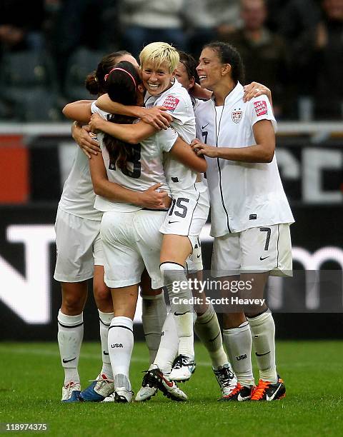 The USA team celebrate after scoring their second goal during the FIFA Women's World Cup 2011 Semi Final match between France and USA at Borussia...