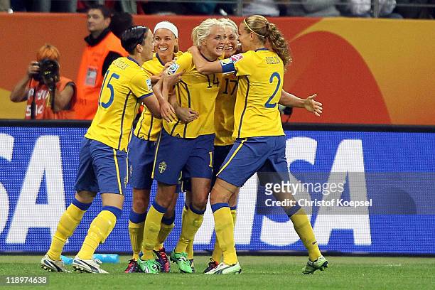 Josefine Oqvist of Sweden celebrates the first goal with Therese Sjogran of Sweden and Charlotte Rohlin of Sweden during the FIFA Women's World Cup...