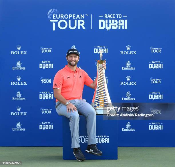 Jon Rahm of Spain poses with the Race to Dubai trophy following his victory during Day Four of the DP World Tour Championship Dubai at Jumerirah Golf...