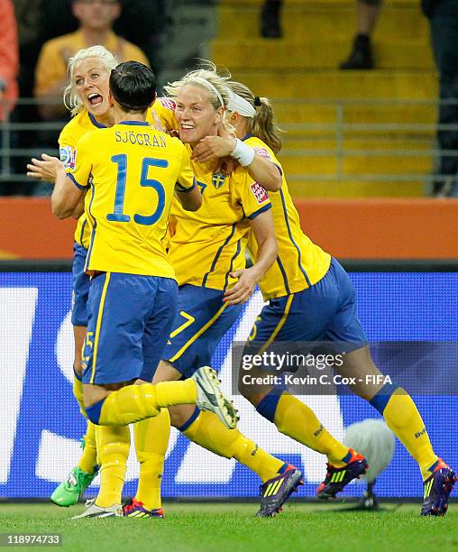 Josefine Oqvist of Sweden celebrates after scoring the first goal against Japan with Lisa Dahlkvist, Sara Thunebro and Therese Sjogran during the...