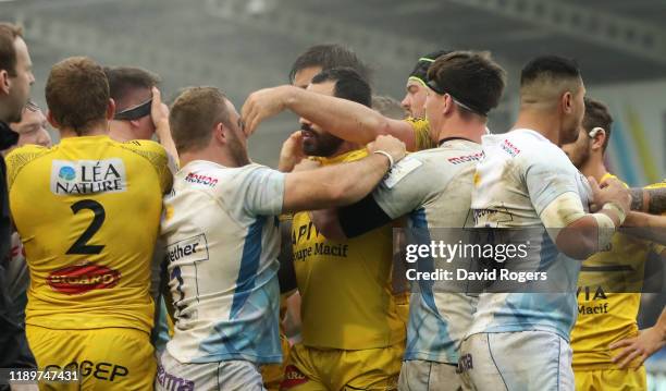 Pierre Bourgarit of La Rochelle stretches to grab Tom Curry around the face and is sent off by referee Andrew Brace during the Heineken Champions Cup...