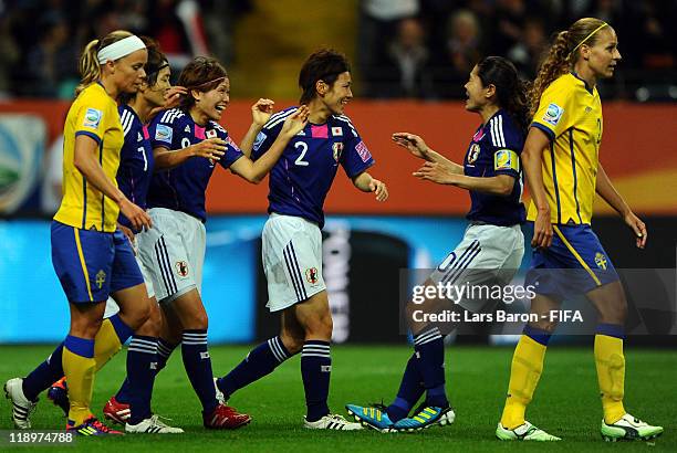 Nahomi Kawasumi of Japan celebrates with team mates after scoring his teams first goal during the FIFA Women's World Cup Semi Final match between...