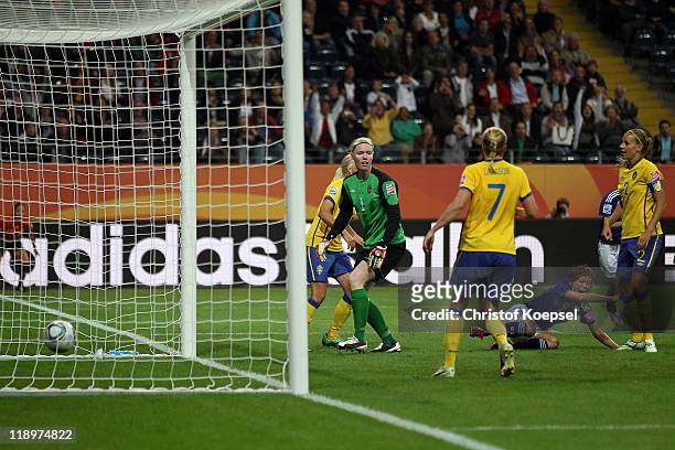 Nahomi Kawasumi of Japan scores the first goal and Hedvig Lindahl of Sweden lets the ball through her legs during the FIFA Women's World Cup Semi...