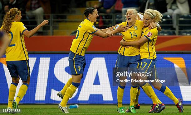 The team of Sweden celebrates Josefine Oeqvist scoring their team's first goal during the FIFA Women's World Cup Semi Final match between Japan and...