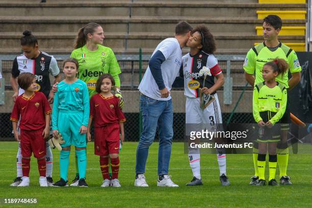 Sara Gama of Juventus receives a flower to celebrate the international day for the elimination of violence against women before the Women Serie A...