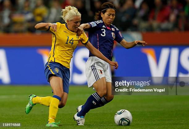 Azusa Iwashimizu of Japan and Josefine Oeqvist of Sweden battle for the ball during the FIFA Women's World Cup Semi Final match between Japan and...