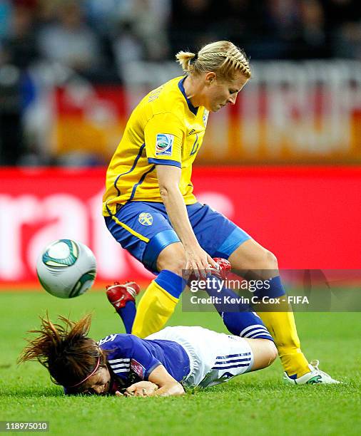 Annica Svensson of Sweden tackles Nahomi Kawasumi of Japan during the FIFA Women's World Cup Semi Final match between Japan and Sweden at the FIFA...