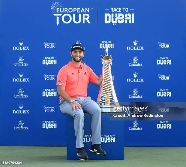 Jon Rahm of Spain poses with the Race to Dubai trophy following his victory during Day Four of the DP World Tour Championship Dubai at Jumerirah Golf...