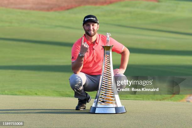 Jon Rahm of Spain poses with the Race to Dubai trophy following his victory during Day Four of the DP World Tour Championship Dubai at Jumerirah Golf...