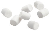 Flying marshmallows on white