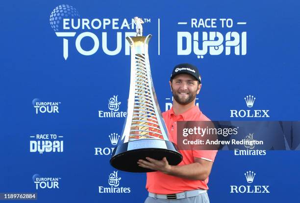 Jon Rahm of Spain poses with the Race to Dubai trophy following his victory during Day Four of the DP World Tour Championship Dubai at Jumerirah Golf...