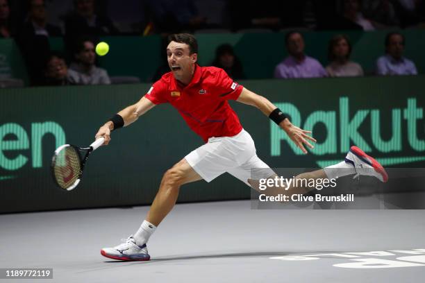 Roberto Bautista Agut of Spain stretches to play a forehand in his singles final match against Felix Auger-Aliassime of Canada during Day Seven of...