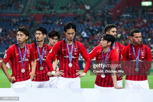 Players of Urawa Red Diamonds show their dejection after the AFC Champions League Final second leg match between Urawa Red Diamonds and Al Hilal at...