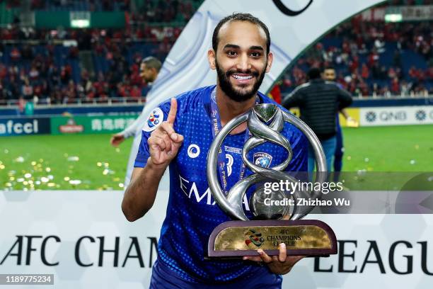 Abdullah Otayf of Al Hilal celebrates the champion with the trophy after the AFC Champions League Final second leg match between Urawa Red Diamonds...
