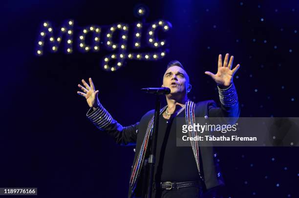 Robbie Williams performs live on stage during Magic Radio's Magic of Christmas with 'Last Christmas' at London Palladium on November 24, 2019 in...
