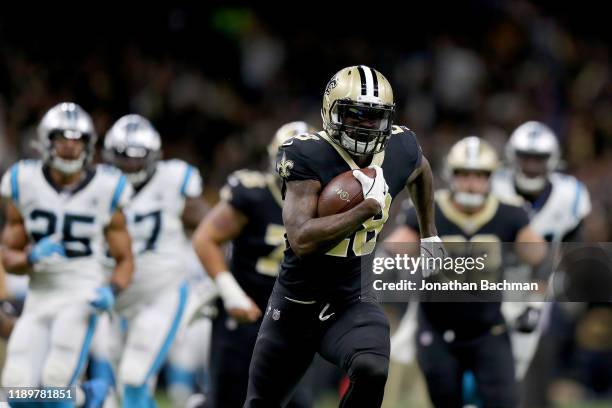 Latavius Murray of the New Orleans Saints scores a 26 yard touchdown against the Carolina Panthers during the first quarter in the game at Mercedes...