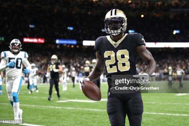 Latavius Murray of the New Orleans Saints scores a 26 yard touchdown against the Carolina Panthers during the first quarter in the game at Mercedes...