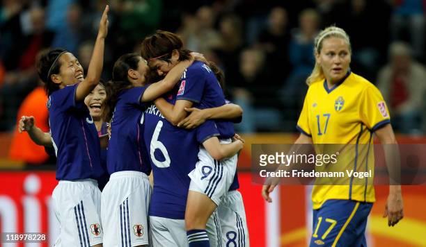 The team of Japan celebrate Nahomi Kawasumi after scoring a goal during the FIFA Women's World Cup Semi Final match between Japan and Sweden at the...