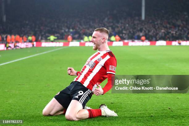 Oli McBurnie of Sheffield United celebrates scoring his teams third goal during the Premier League match between Sheffield United and Manchester...