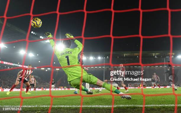 Oli McBurnie of Sheffield United scores past David de Gea to make it 3-3 during the Premier League match between Sheffield United and Manchester...