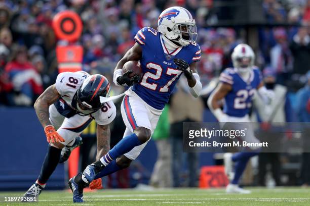 Tim Patrick of the Denver Broncos attempts to tackle Tre'Davious White of the Buffalo Bills after White intercepted the ball during the second...