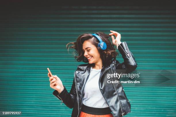 millennial girl enjoying disco music - bulgaria dance stock pictures, royalty-free photos & images