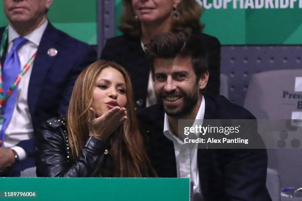 Singer Shakira and her husband and footballer Gerard Pique of FC Barcelona react in the stands as they watch the singles final match between Rafael...