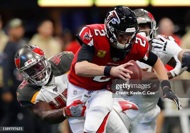 Devin White of the Tampa Bay Buccaneers sacks Matt Ryan of the Atlanta Falcons in the first half at Mercedes-Benz Stadium on November 24, 2019 in...