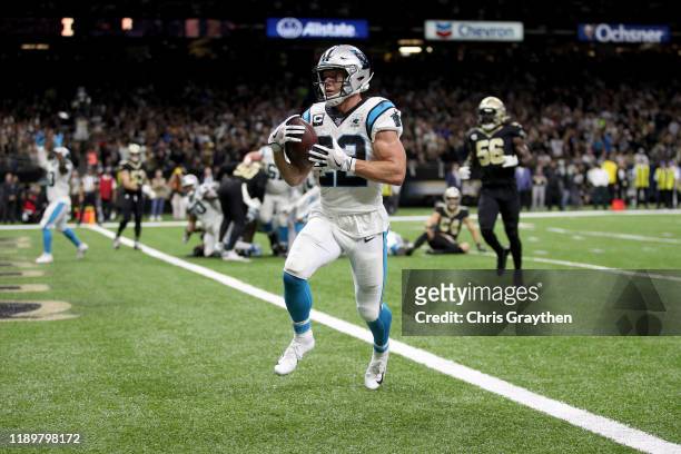 Christian McCaffrey of the Carolina Panthers scores a 1 yard touchdown against the New Orleans Saints during the second quarter in the game at...