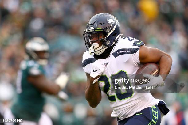 Rashaad Penny of the Seattle Seahawks carries the ball against the Philadelphia Eagles in the first half at Lincoln Financial Field on November 24,...