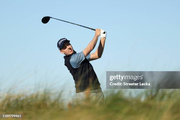 Webb Simpson of the United States plays his shot from the 15th tee during the final round of the RSM Classic on the Seaside course at Sea Island Golf...