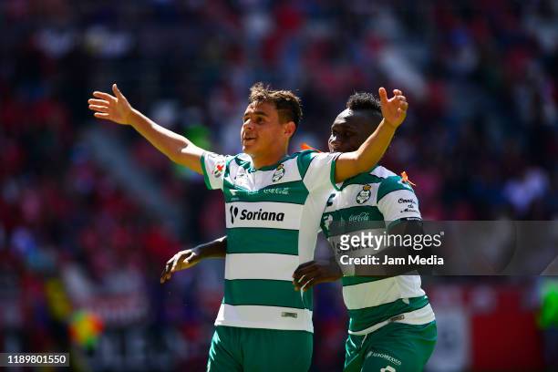 Edgar Games of Santos celebrates after scoring the second goal of his team with teammate Eryc Castillo during the 19th round match between Toluca and...
