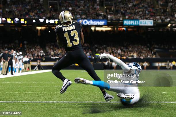 Michael Thomas of the New Orleans Saints catches a 3 yard touchdown pass from Drew Brees against the Carolina Panthers during the third quarter in...