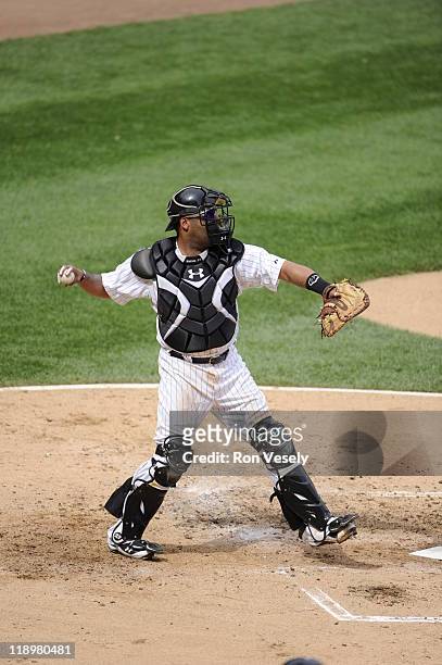 Ramon Castro of the Chicago White Sox throws the ball while catching against the Washington Nationals on June 25, 2011 at U.S. Cellular Field in...